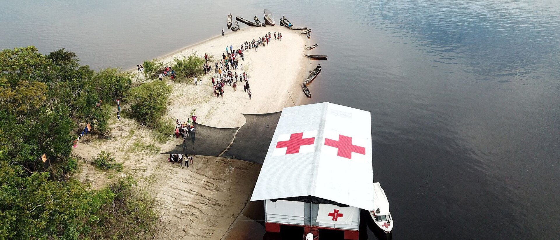 International Cooperation Strategy Red Cross boat at shore